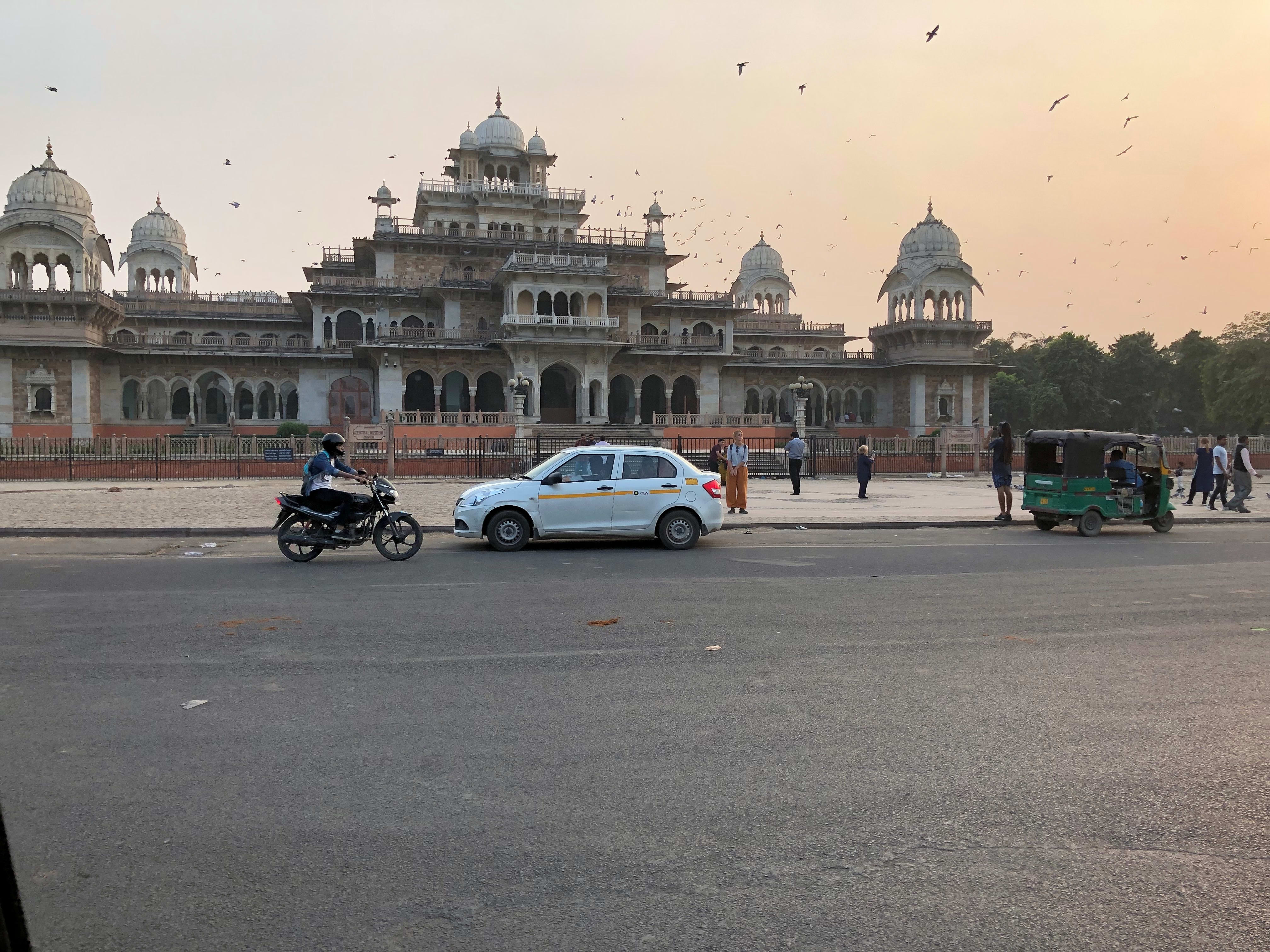 Albert Hall Museum in Jaipur with birds and traffic in the foreground.