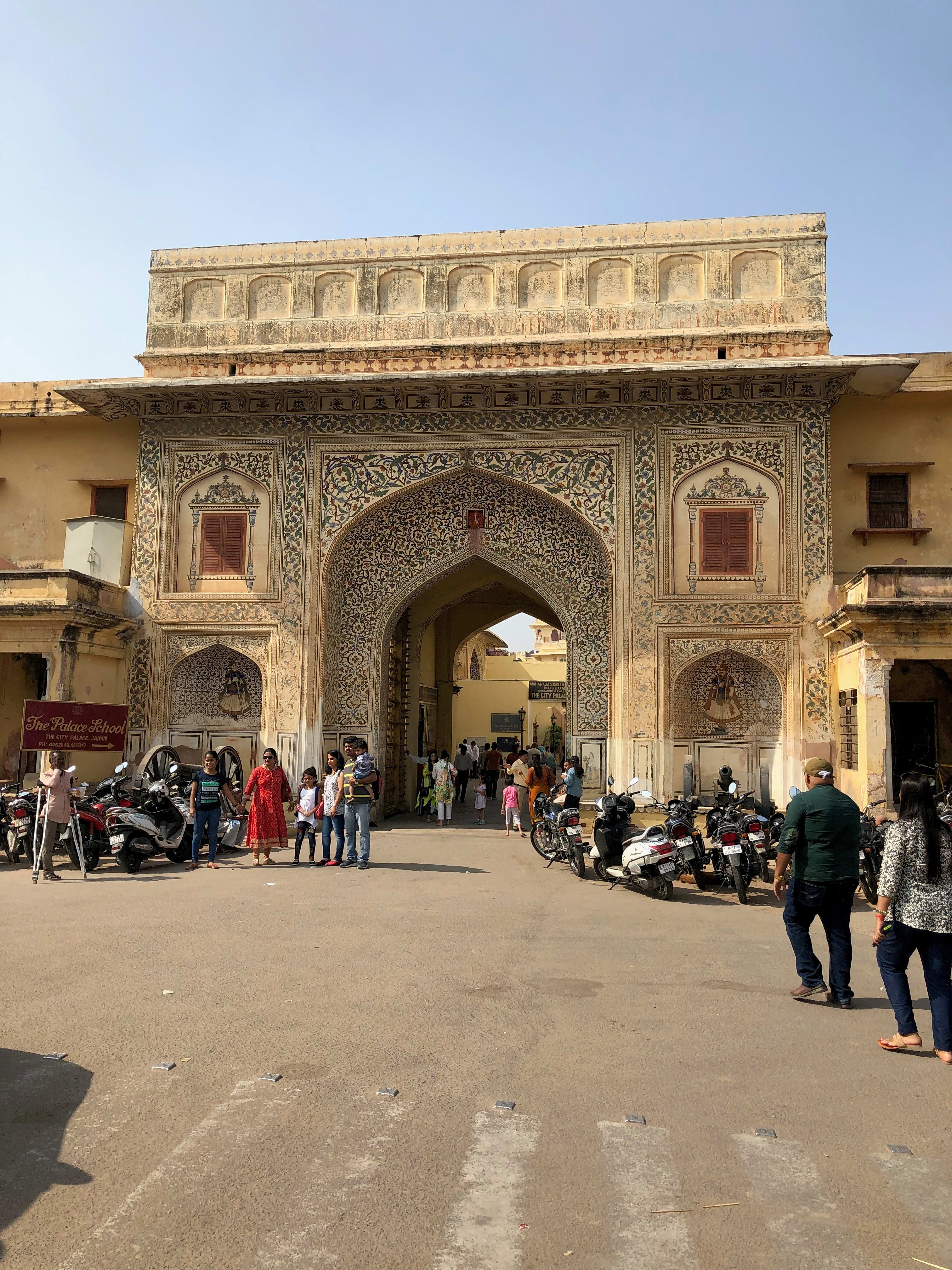 An architectural entrance and visitors in Jaipur; individual gate identification unconfirmed.