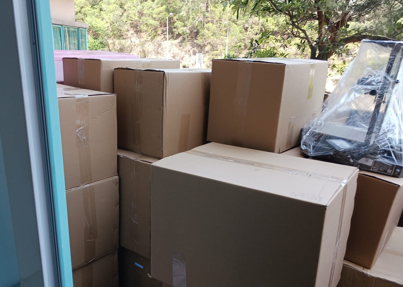 Truck loaded with protected furniture and mattresses, tail lift down