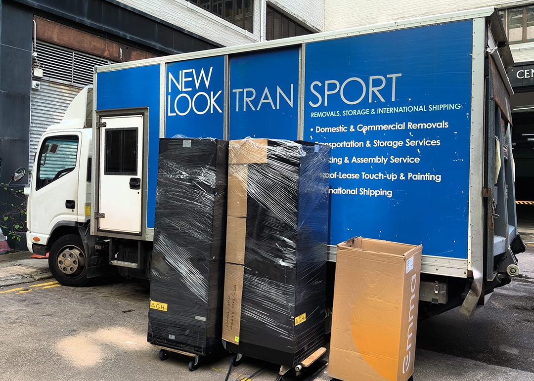 Furniture shrink-wrapped and packed boxes ready for loading