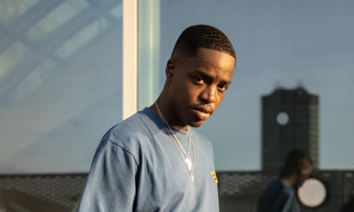 Young black man on a mobile phone 