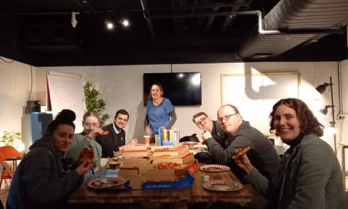 The Radio Platfform Steering Group eating pizza together