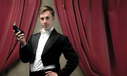 Comedian, Lord Hicks is dressed to impress and ready to take you on a musical romp through queer history