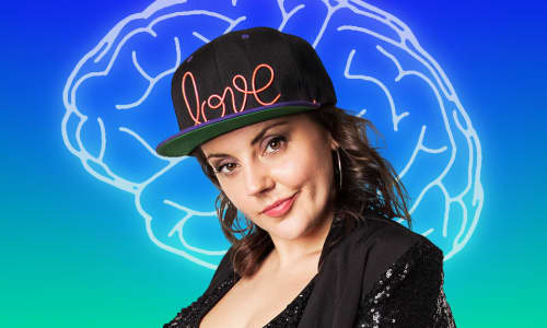 Carys Eleri stood in front of a green and blue background with an image of the brain