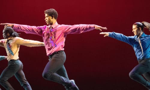 Four dancers from Acosta Danza performing on stage