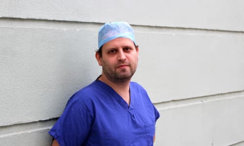 Author and Doctor, Adam Kay, in scrubs ahead of his performance at Wales Millennium Centre in March 2020
