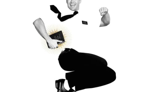 Black and white image of a smiling man leaping high into the air while clutching a bible under one arm