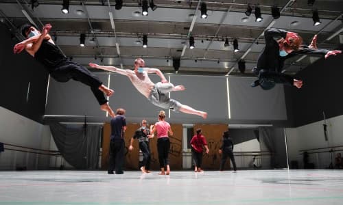 Dancers jumping in the air by Miguel Altunaga Jr