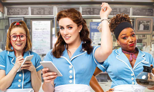 Three women dressed as waitresses