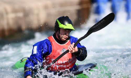 A man canoeing at the White Water Rafting Centre in Cardiff Bay