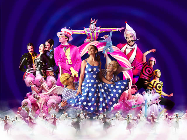 Multiple people in colourful costumes from The Nutcracker dancing and singing Multiple people in colourful costumes from The Nutcracker dancing and singing