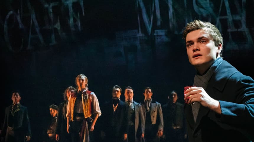 Marius in foreground singing empty chairs and tables 