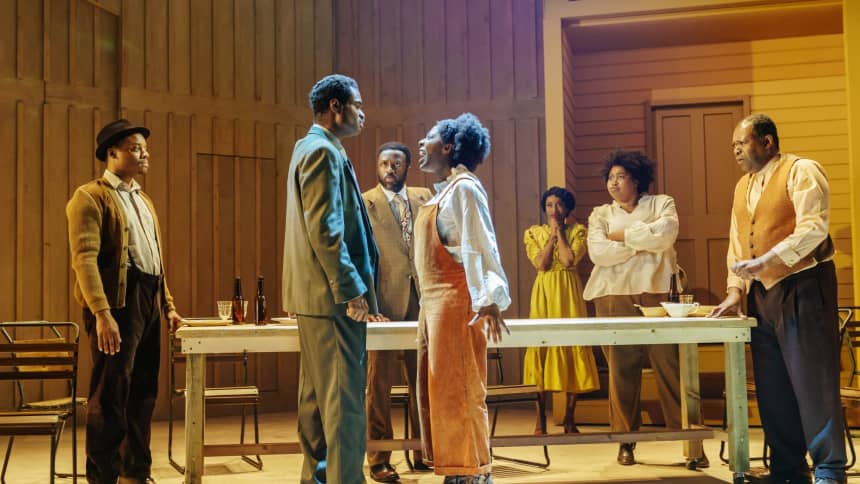 A woman confronting a man at a dining table