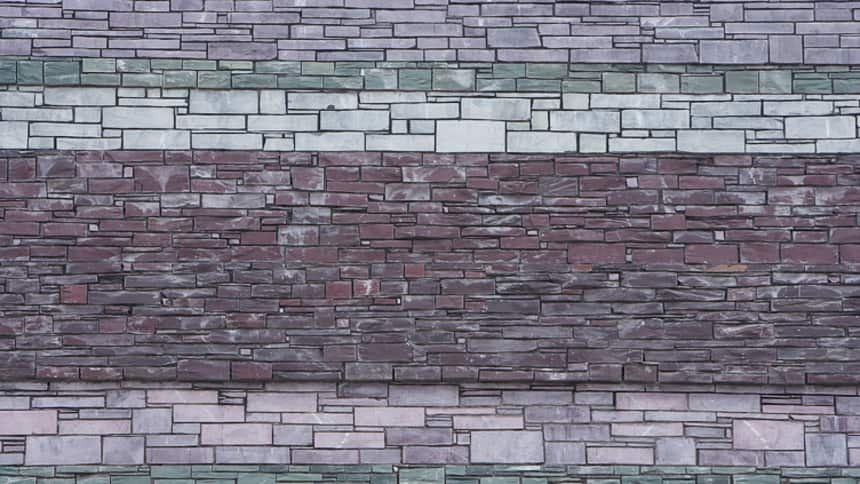 Slate cladding on the exterior represents local rock strata found along the local sea cliffs of South Wales