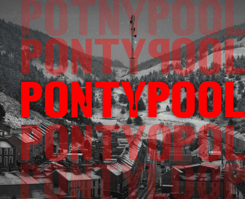 A radio beacon in the middle of a snow covered valley town. Repeated text reads PONTYPOOL