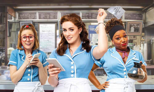 three women dressed as waitresses