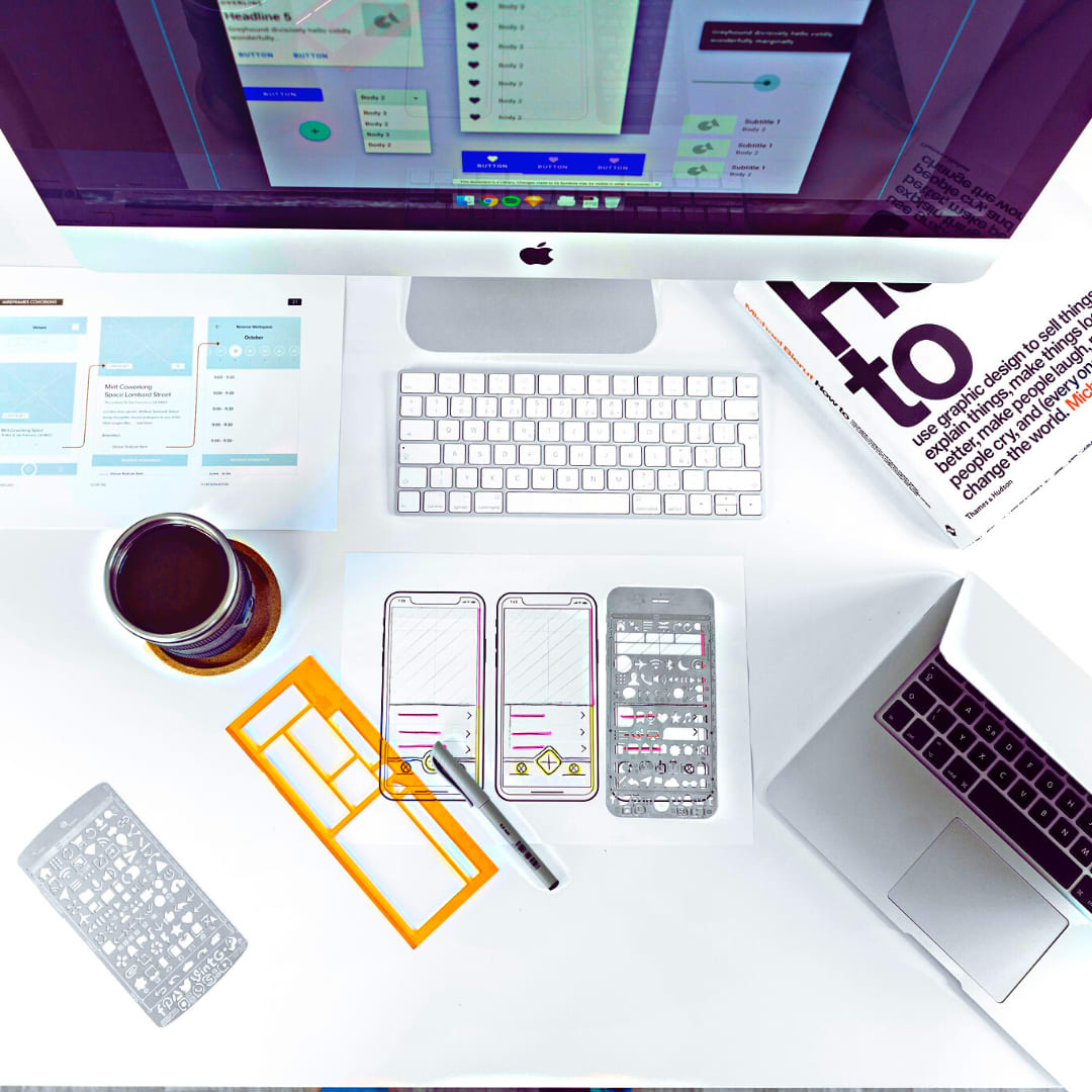 Imac on desk in the process of designing a website.