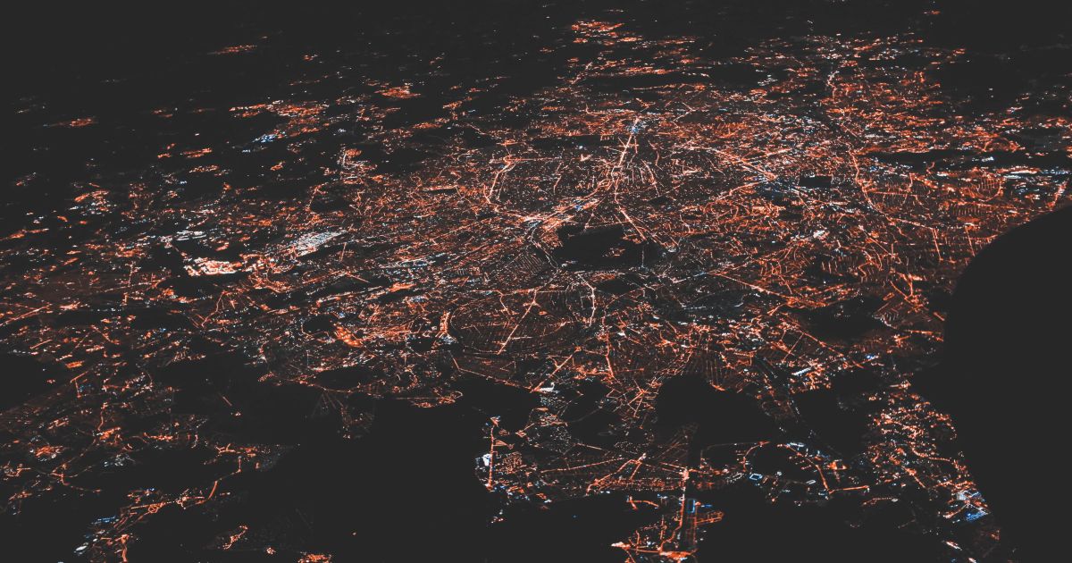 Birds-eye view of city street grid at night