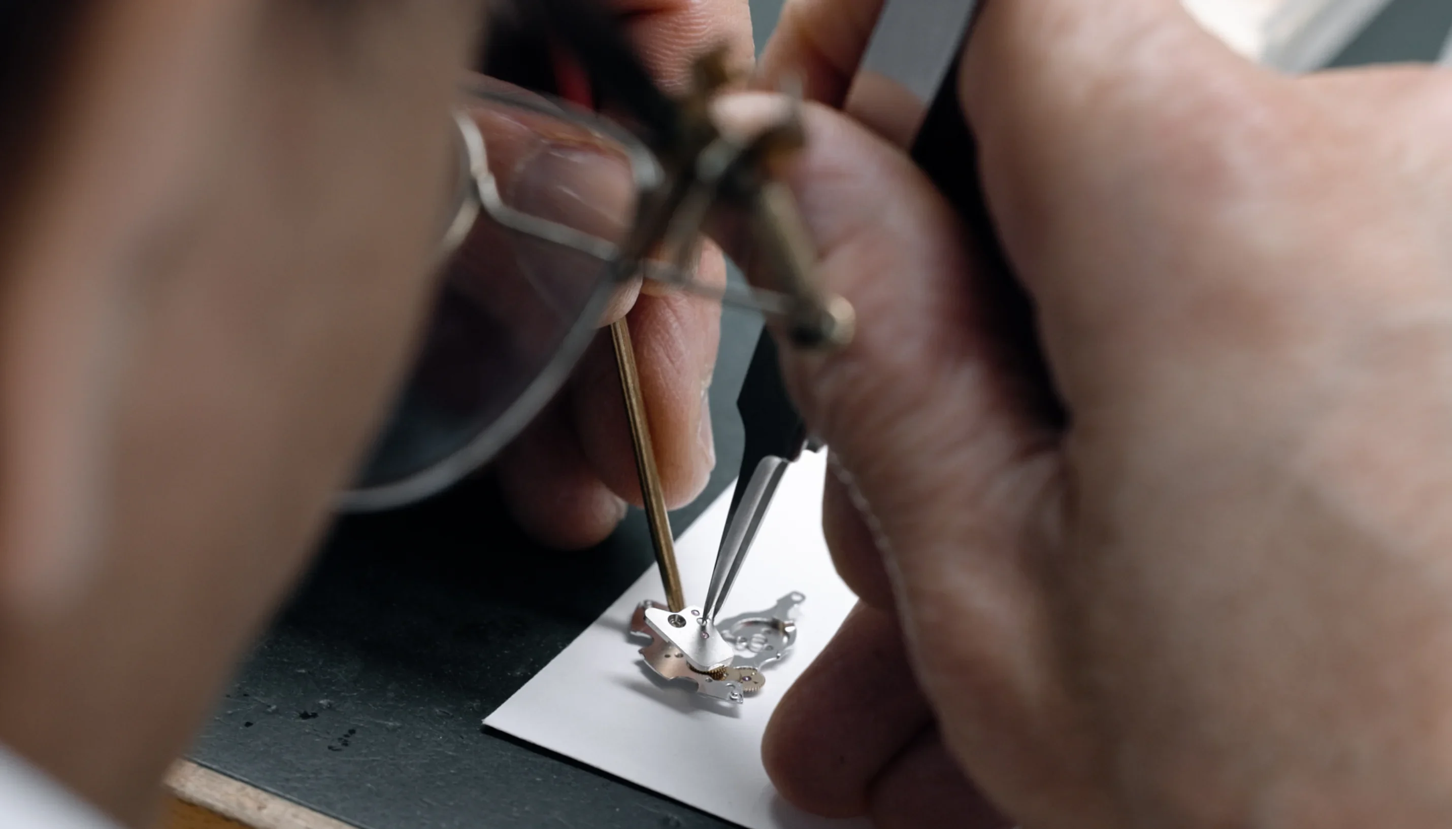 watchmaker repairing movement