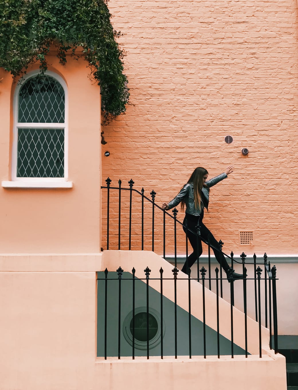 Image of a woman walking down steps.