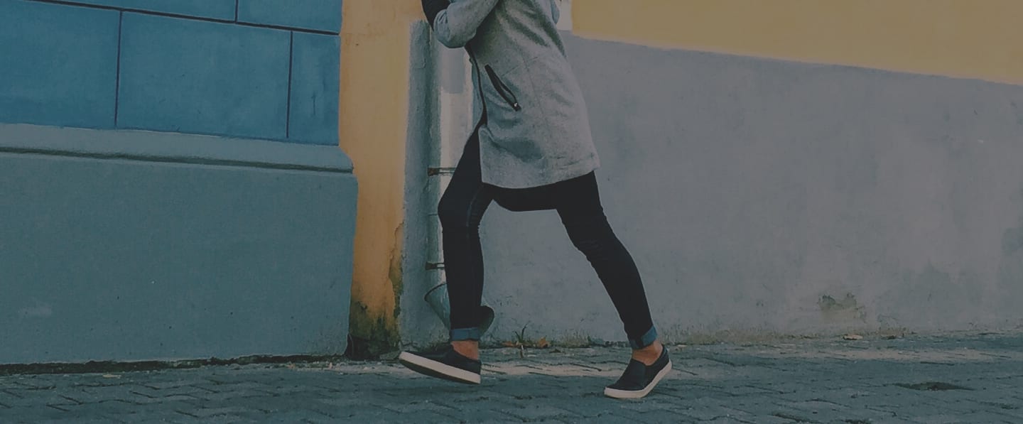Image of female walking on the sidewalk
