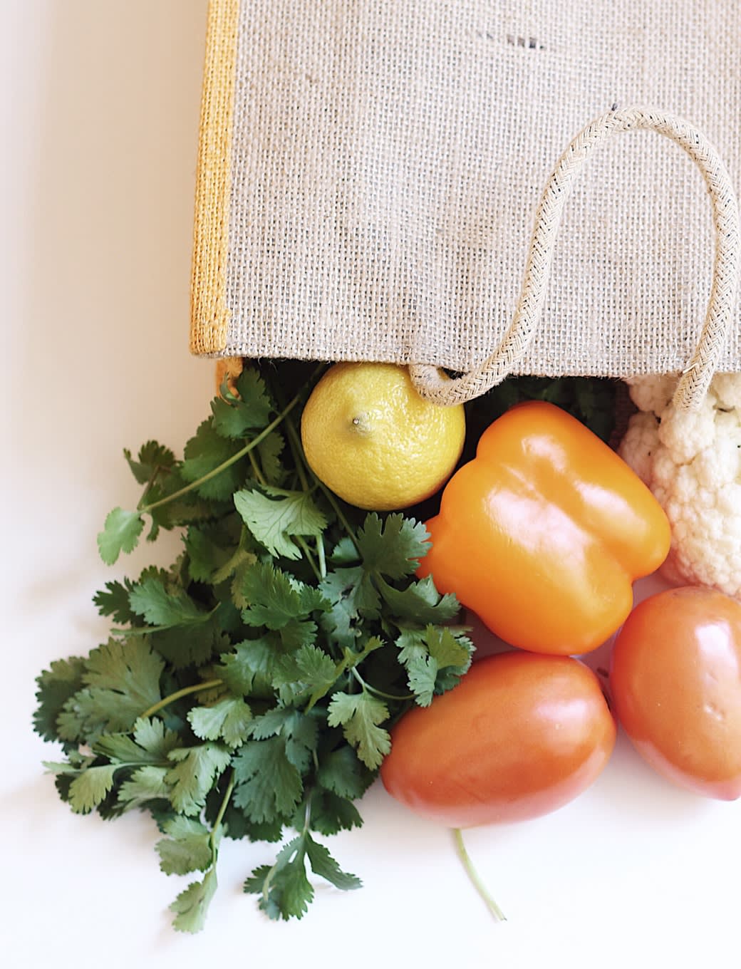 Image of groceries falling out of a bag.