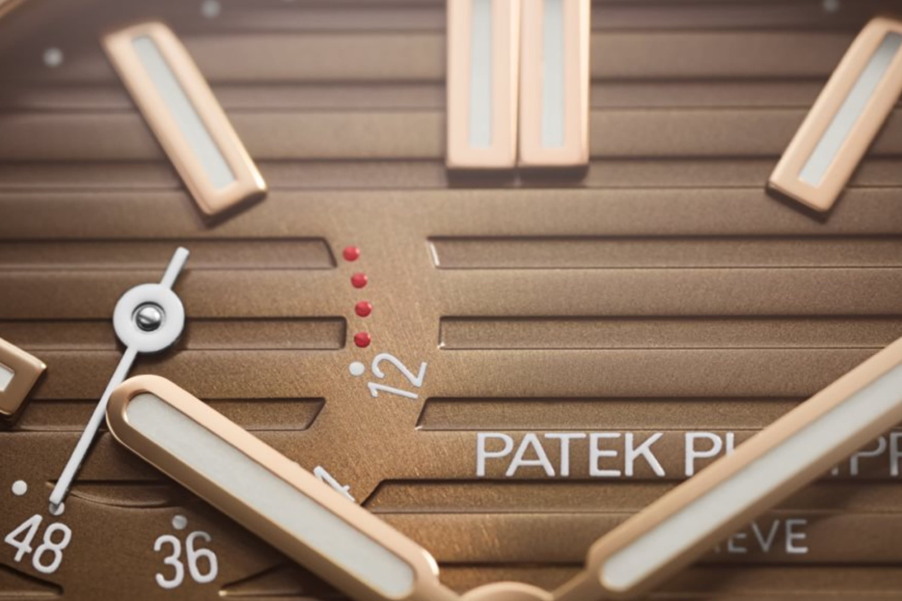 Patek Philippe Nautilus ref. 5712/1R and 5712/1G