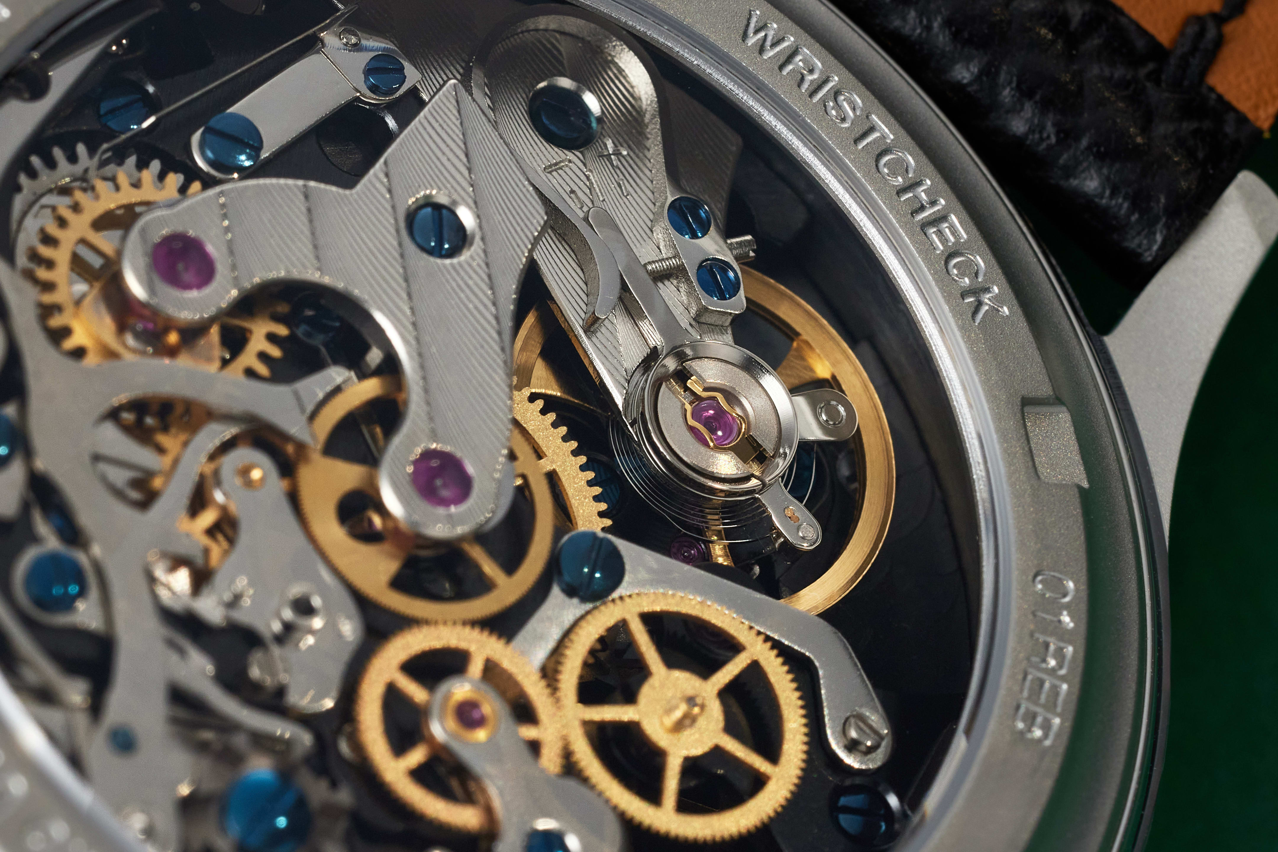The ST-1901B movement features a sleek, jet-black main plate that showcases the bridges, wheels, and balance