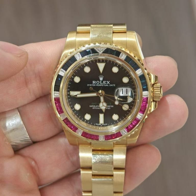 GMT-Master II Yellow Gold Sapphire Ruby Black Dial 40mm Product Image 1