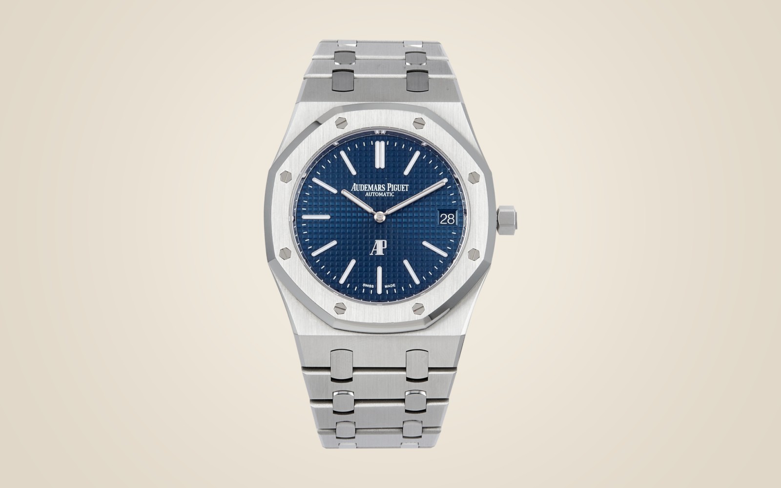 Audemars Piguet Royal Oak "Jumbo" Extra-Thin 16202ST on champagne background