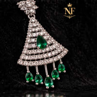Fan shaped gold tone earrings with Emerald Green stones and sparkling CZ detailing