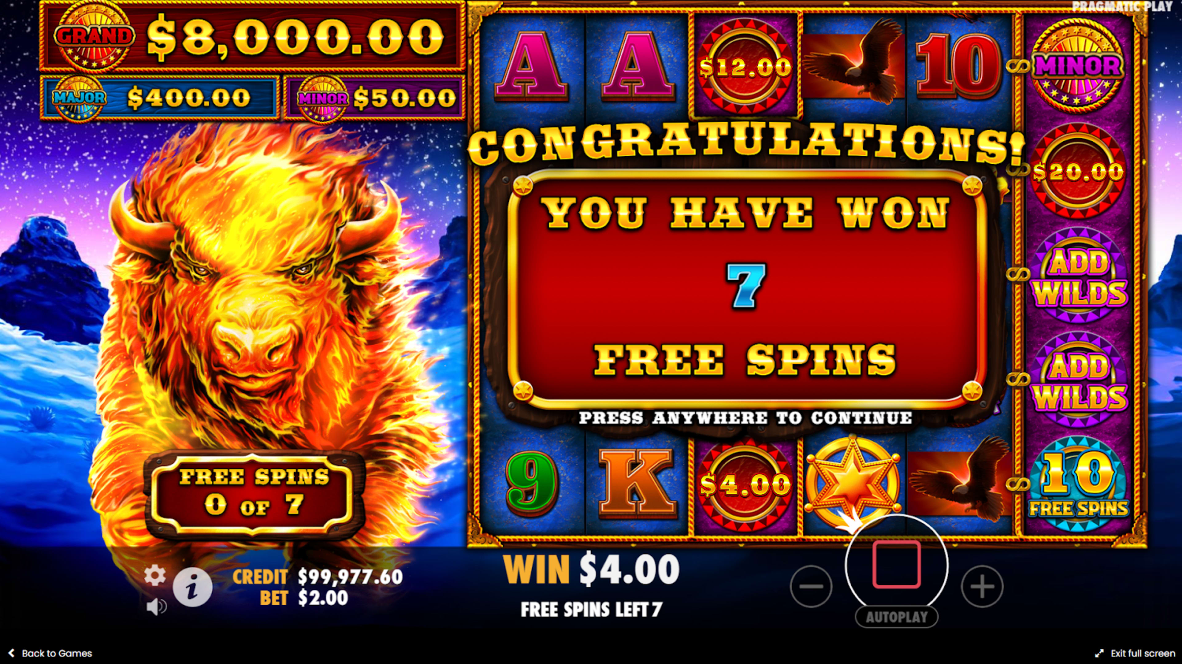 Stampede slot base game win with elephants and traditional African wildlife symbols.