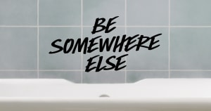 Be Somewhere Else written over a bath tub, showing the need for wellbeing over social media