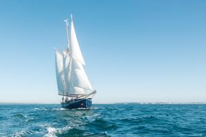 Cork pots arriving into Poole Harbour by sail boat