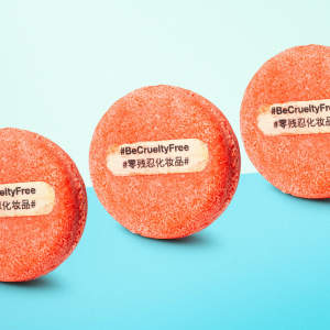 3 New shampoo bars with #BeCrueltyFree written on them stand against a blue background.