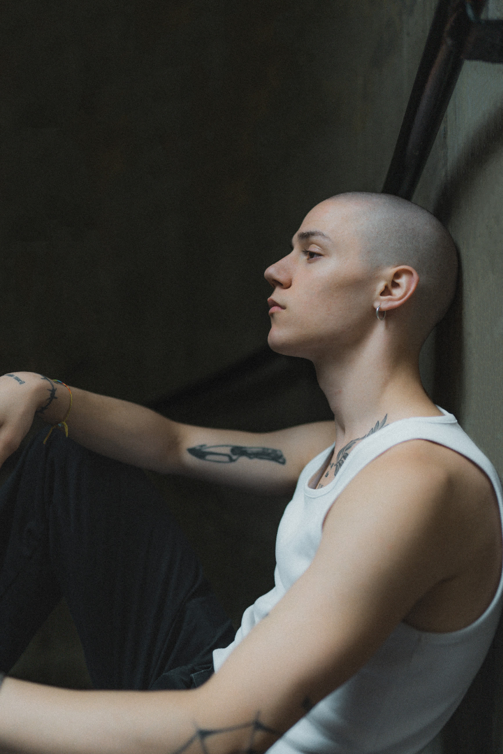 Portrait of a bald guy with tattoos