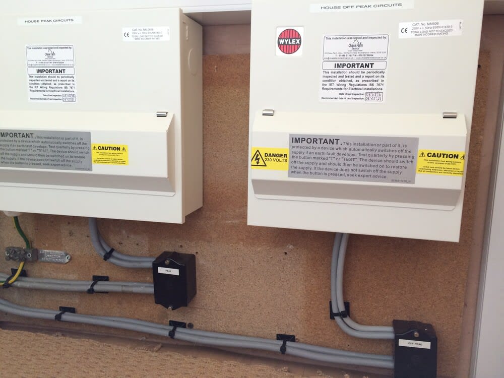 Professional electrician installing a modern dual RCD consumer unit in a residential home, ensuring electrical safety and compliance with the latest standards.