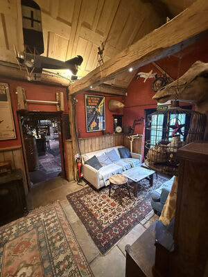 A wider view of lighting in the pub’s beamed seating area.