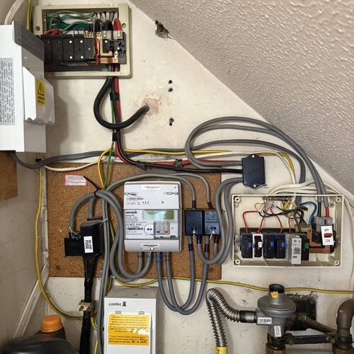 Electrician checking earthing and bonding connections in residential rental property