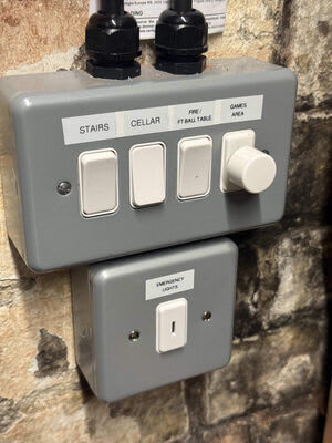 Labelled switches and a separate emergency-lighting key switch.