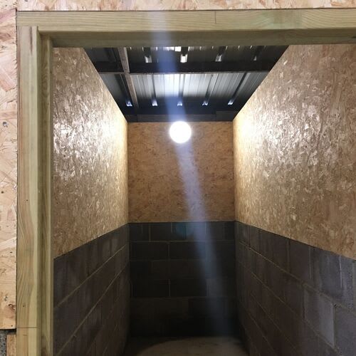 Equestrian stable electrical installation with weatherproof fixtures.\r\n