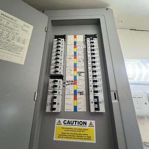 Chase Farm Electrical Contractors conducting an Electrical Installation Condition Report on an old 3 phase fuse board in a nursing home for insurance purposes