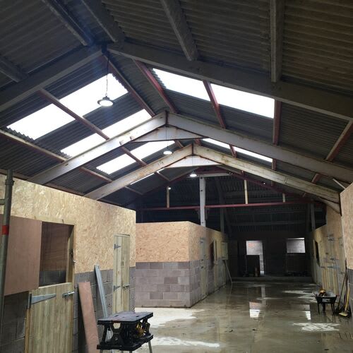 Agricultural building electrics, including power outlets and lighting for machinery workshops.\r\n