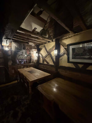 Another view of the lighting arranged around exposed beams.