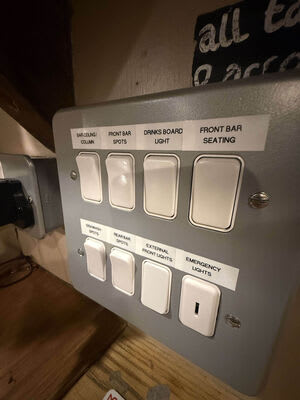 Labelled lighting switches for the bar and seating areas.