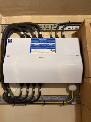 The main distribution board, with labelled cables and associated containment.