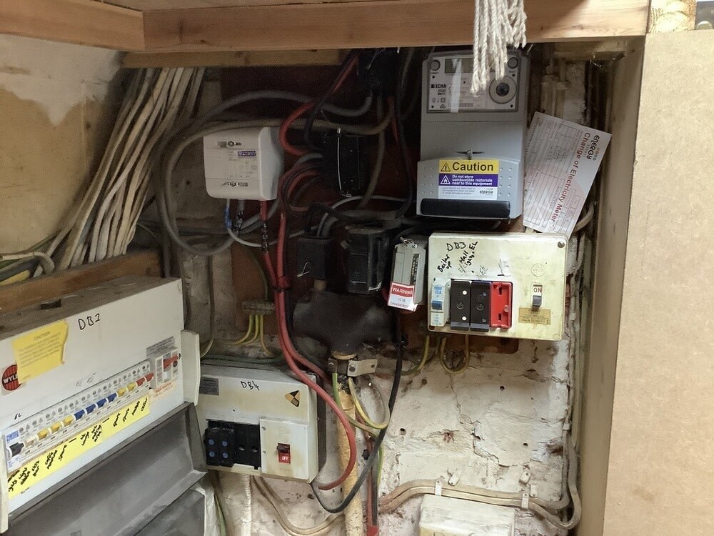 Distribution boards and supply equipment at a Winchester pub before rewiring