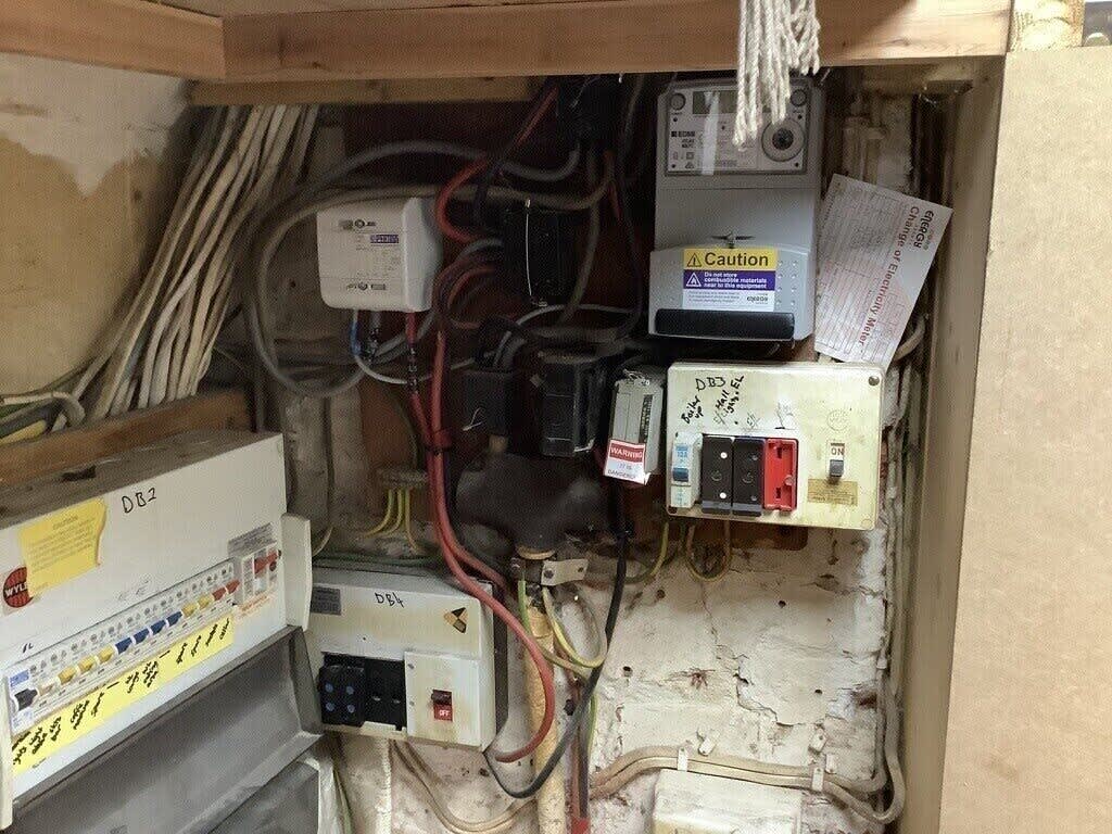 Existing fuse boards, switches and electrical supply equipment at a Winchester pub