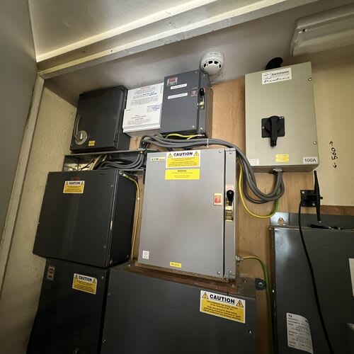 \"Chase Farm Electrical Contractors performing an EICR on an old 3-phase fuse board in a nursing home for electrical safety and compliance\"\r\n\r\n