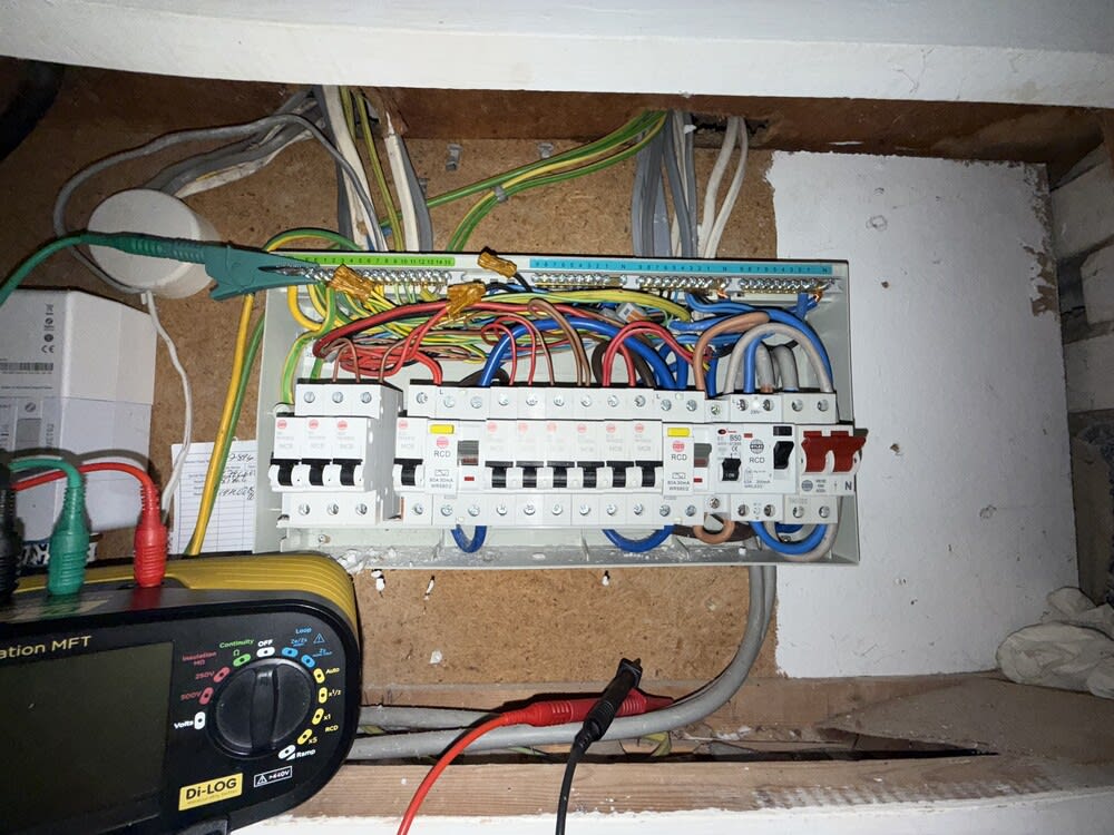 Chase Farm Electrical performing an EICR inspection in a residential property—certified electrician checking sockets and circuits for safety compliance under BS 7671